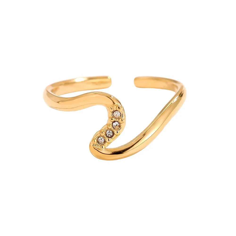 Goldfarbener offener Ring mit geschwungener Form und fünf kleinen Kristallen