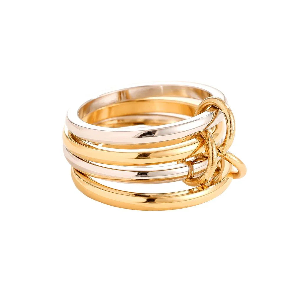 Mehrreihiger Ring aus glänzendem Gold und Silber mit kleinen Ringen als Akzente